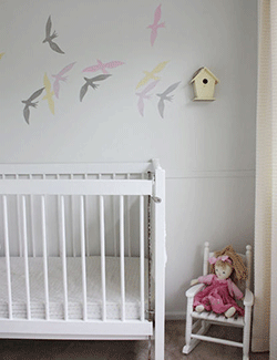 nursery wall decorating with birds images in light gray and pink colors