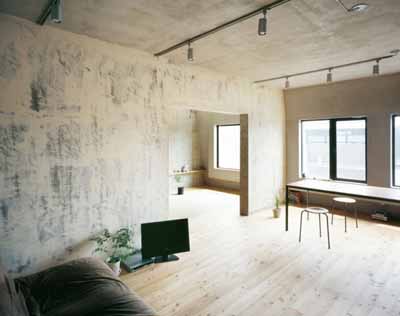 floor bed on wooden floor in bedroom with TV and house plants