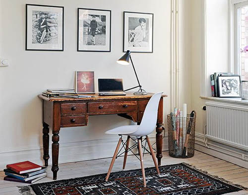 home office design in a corner of a room with wooden writing desk and chair