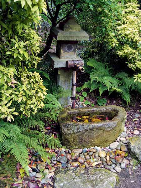 tsukubai water fountain is one of outdoor fountains for japanese garden design