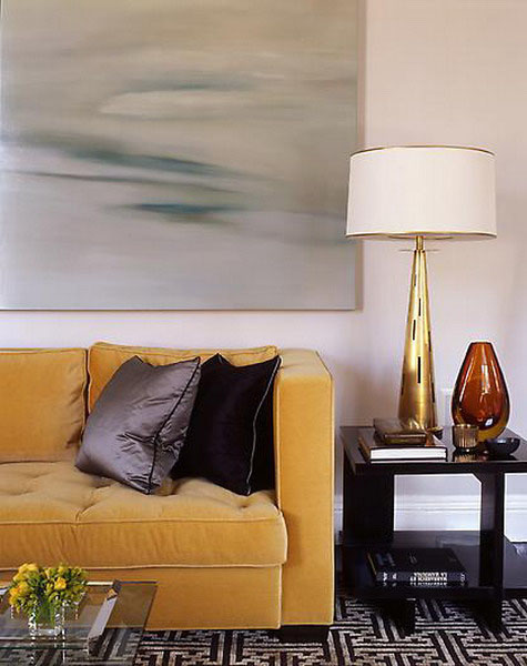 golden yellow finish of table lamp and golden yellow sofa upholstery fabric