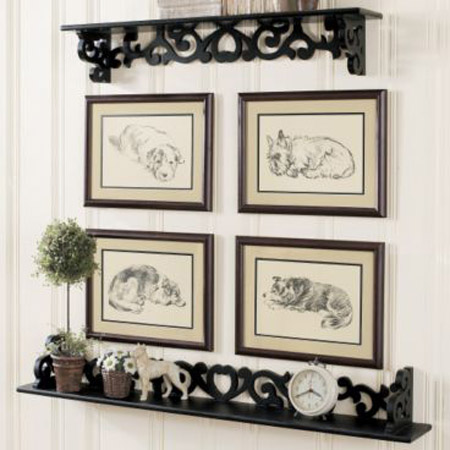 black and white wall decor with black shelves and picture frames