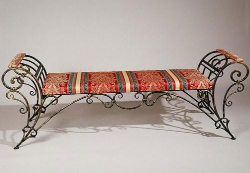 iron bench with striped red cushion