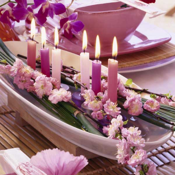 purple and pink flowers and candles centerpiece idea