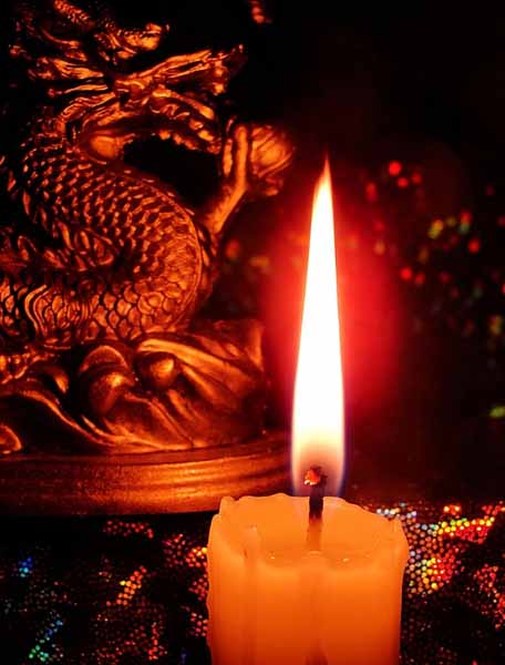 dragon figurine and candle