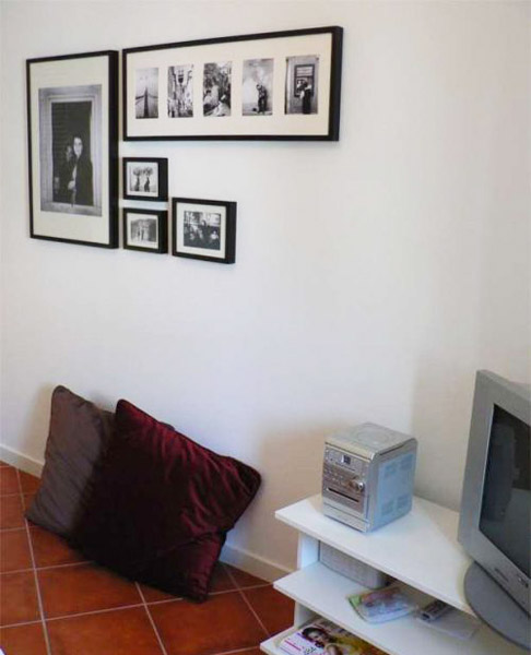 wall decorating with photos in black frames