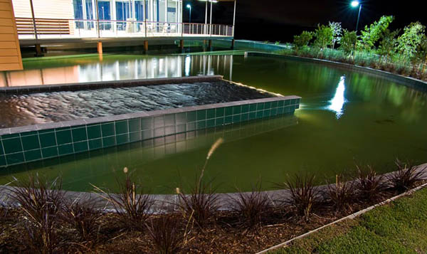 contemporary hone with small pond and water fountain