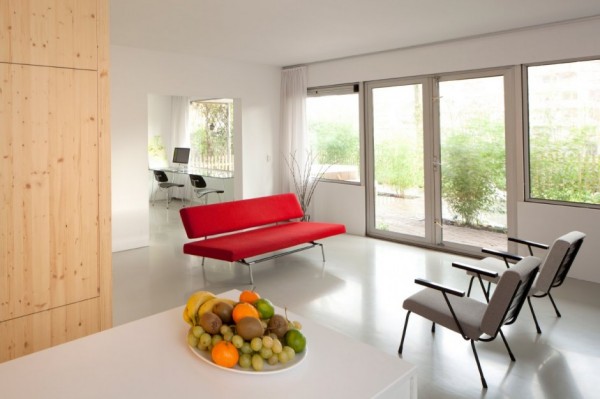 living room design with red sofa and gray chairs