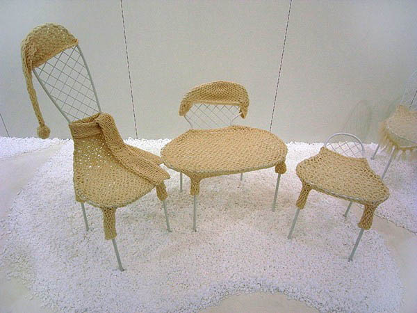 modern chairs in knitted clothes and accessories