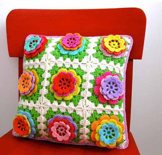 crochet pillow with colorful flowers
