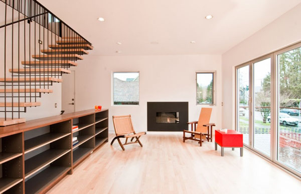 storage cabinets in living room with staircase