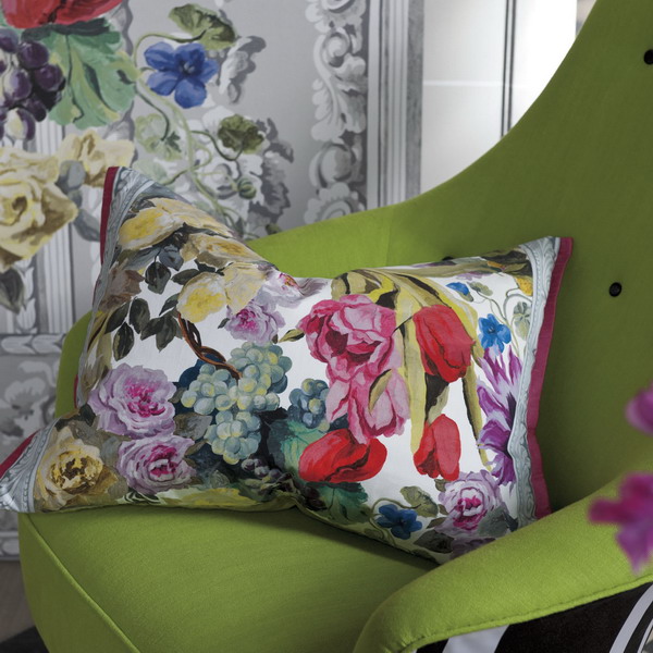bright floral pillow for green chair
