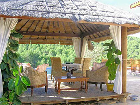 thatched roofing and patio furniture