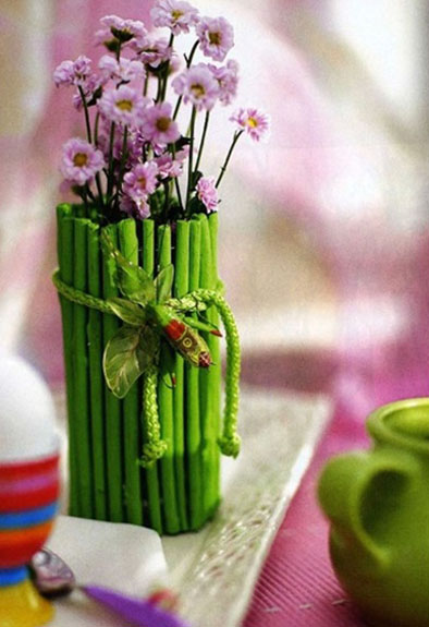 vase decorated with tree branches painted green color