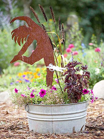 dancer and flowers in metal bucket