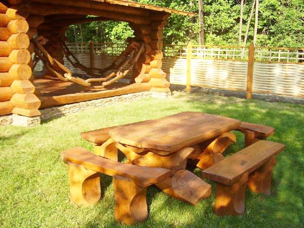 gazebo and table with chairs made of logs