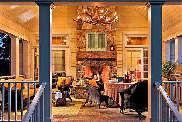 porch decorating with outdoor fireplace and dining furniture