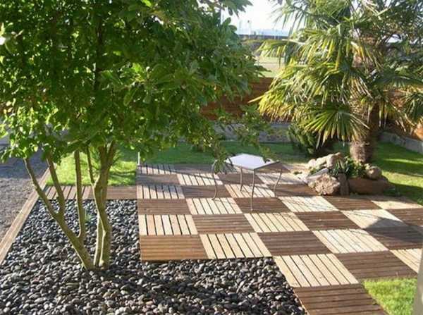 composite deck tiles in light and dark brown colors