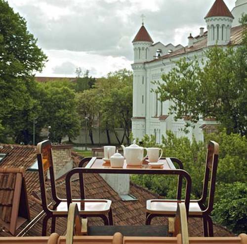 small dining table and chairs on angled roof