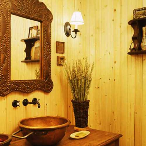 yellow paint and brass sink with wall mirror