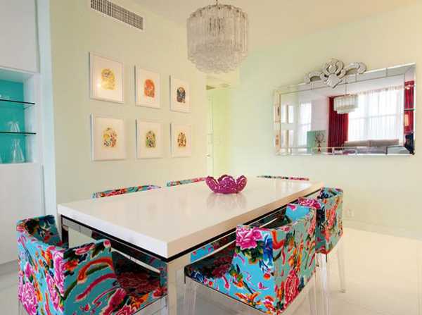 white dining table and colorful chairs