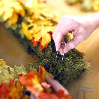 making wreath with fall leaves