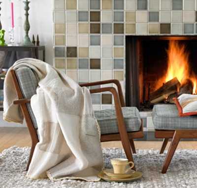 warm blanket on chair beside fireplace