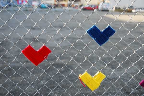 fence decorating with colorful yarn