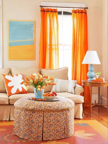 orange curtains and sofa cushions