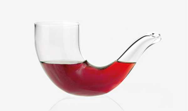 pipe shaped glass with red drink