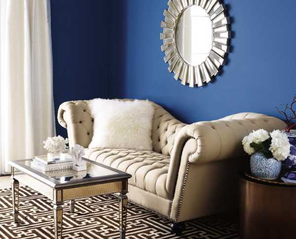 decorative mirror on blue wall