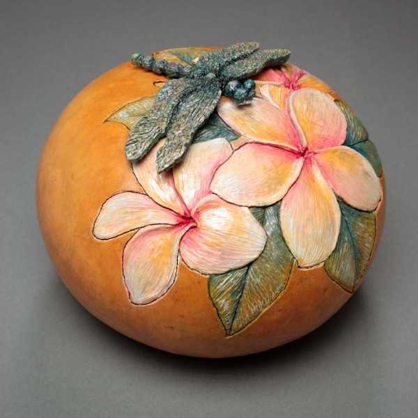 carved pumpkin with floral pattern