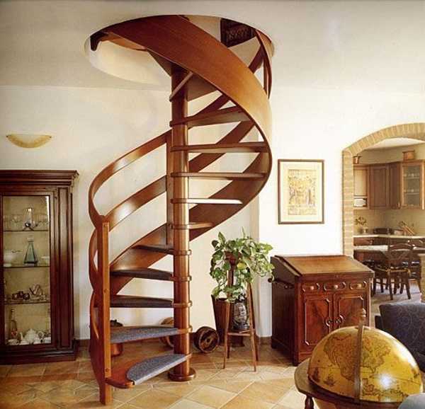 spiral stairs with curved wood railing