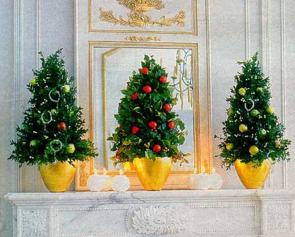 miniature christmas trees for fireplace mantel decorating