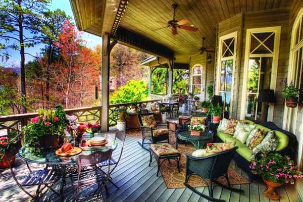 porch decorating with outdoor furniture and flowers