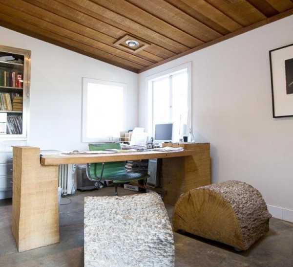 wood desk and seats made from tree trunk with bark