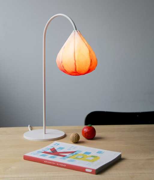 desk lamp with steel base and orange lamp shade