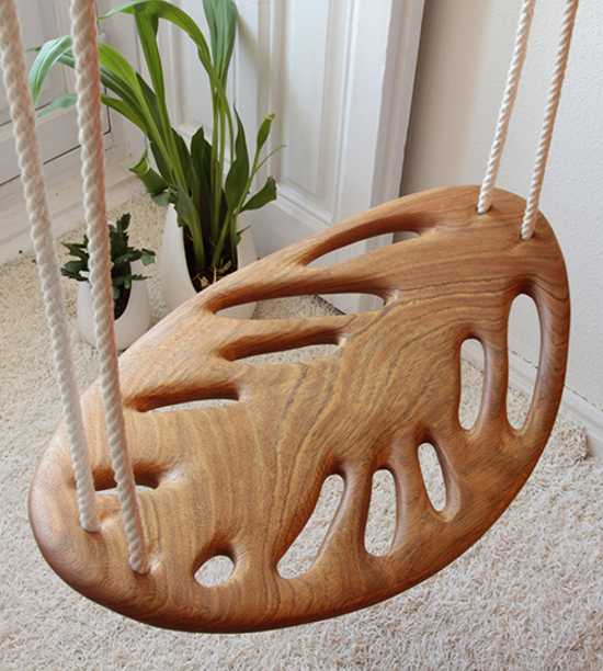 solid wood swing with ropes