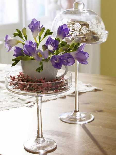purple flower arrangement in cup