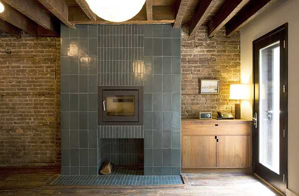 tiled fireplace design in dining room