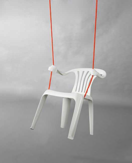 swing made of white plastic chair and rope