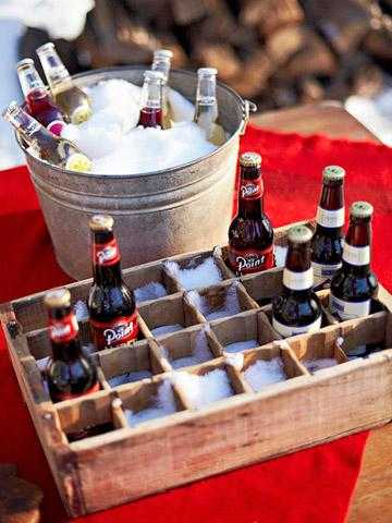 winter party table centerpiece, cold drinks in wooden box and bucket