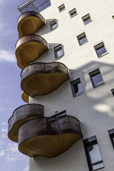 curvy balconies made of metal and wood