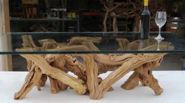 unique furniture, glass top table with base created of old grape vine