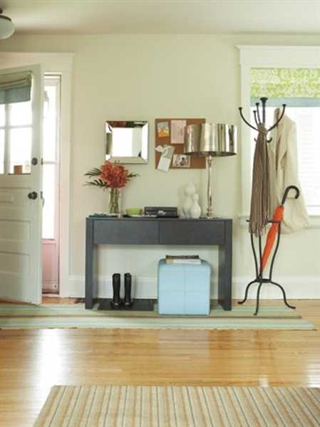 foyer decorating with console table and coat rack