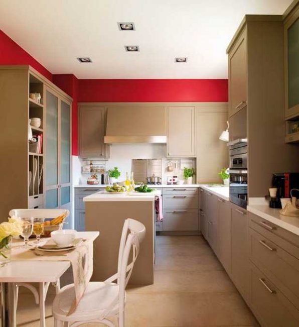 Modern Kitchen Design with Bold Red Accent Walls and Stainless Steel Details