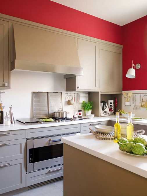 stainless steel appliances and red accent wall painting