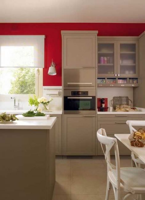 Modern Kitchen Design with Bold Red Accent Walls and Stainless Steel Details