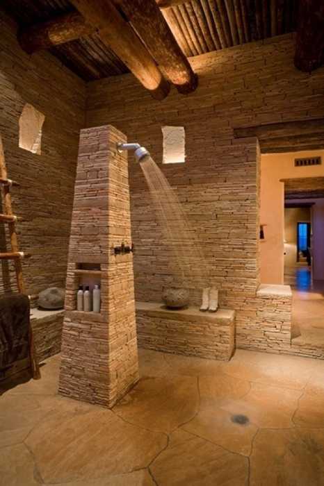 stone bathroom design with open shower