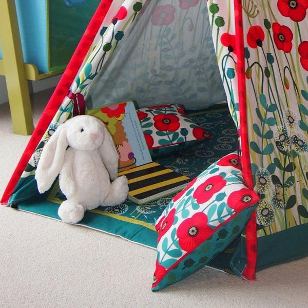 tent and colorful cushions